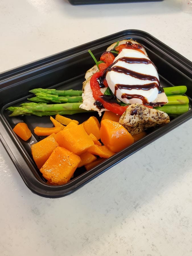 https://healthymealsinc.com/wp-content/uploads/2022/03/Bruschetta-Chicken-with-Buffalo-Mozzarella-Tomato-and-a-Balsamic-Glaze.-Sided-with-Sweet-Potatoes-and-Fresh-Asparagus.jpg